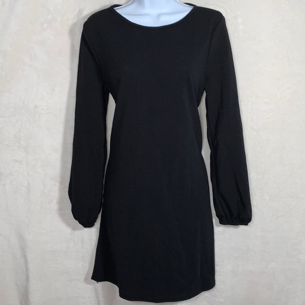 Woman’s long sleeve black dress. Size Medium
